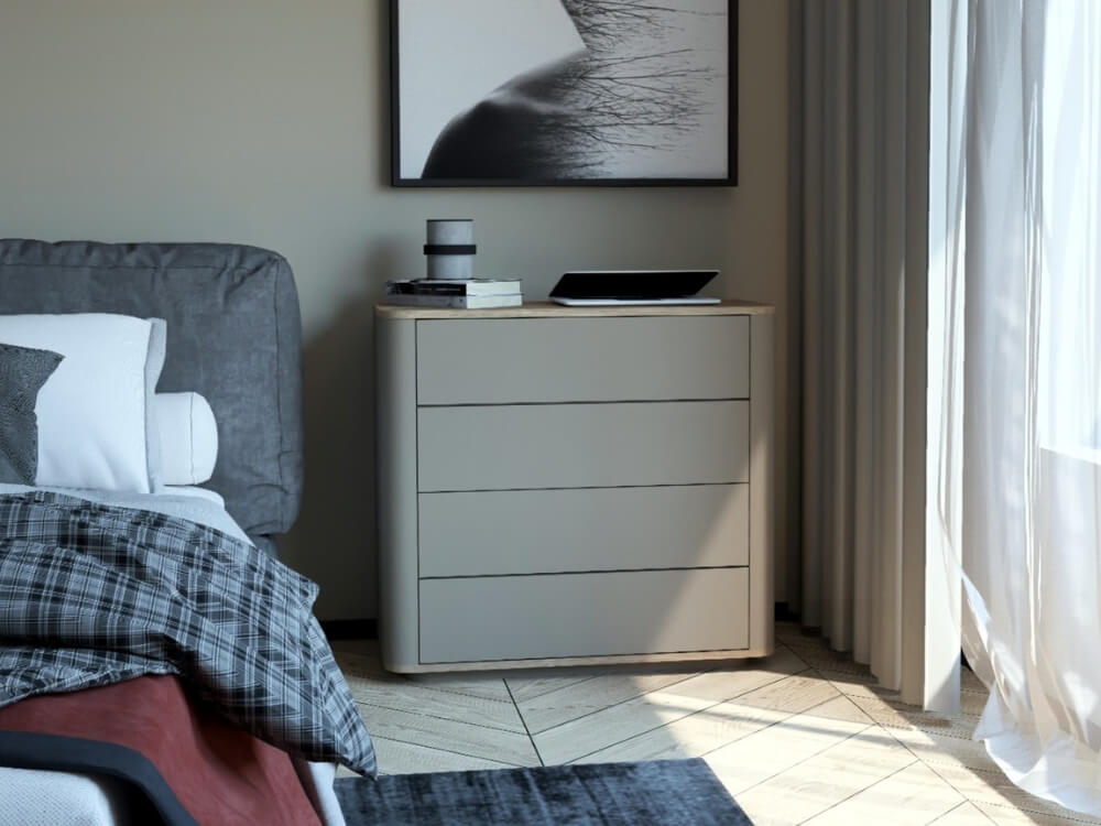 Notebook položený na Komode RO 4Z-95 v spálni.